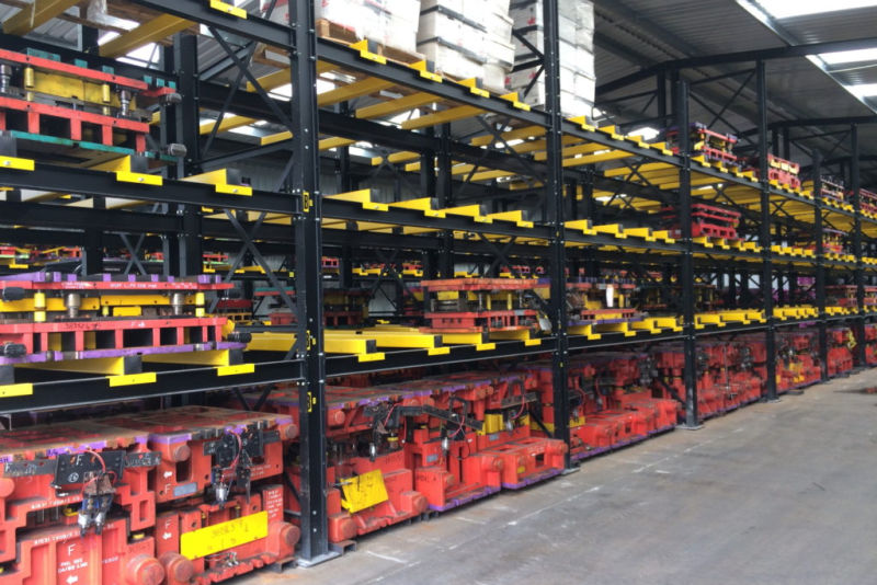 tools stored on fork entry bars of heavy duty racking