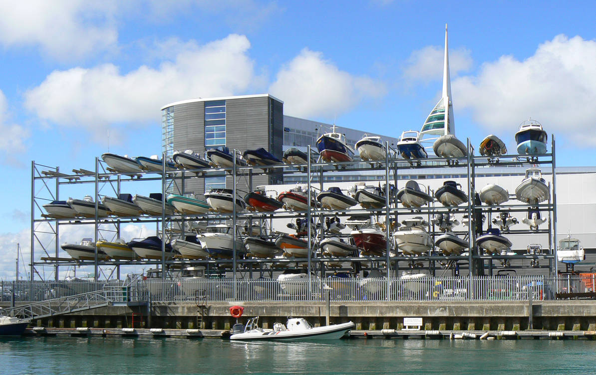 four tier dry stack boat rack full of boats.